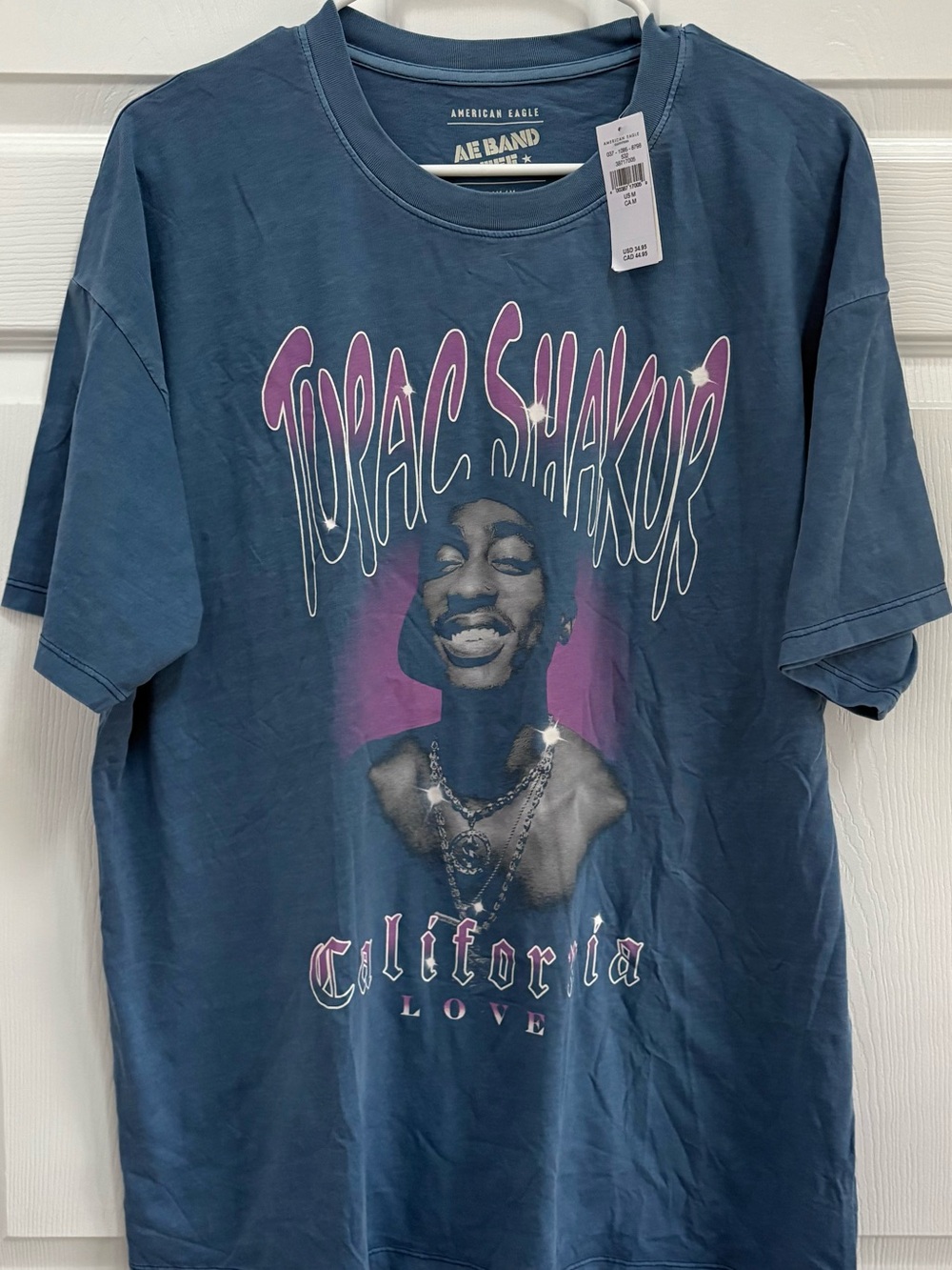 American Eagle Outfitters Blue Graphic Tee with Purple Accent - Tupac California